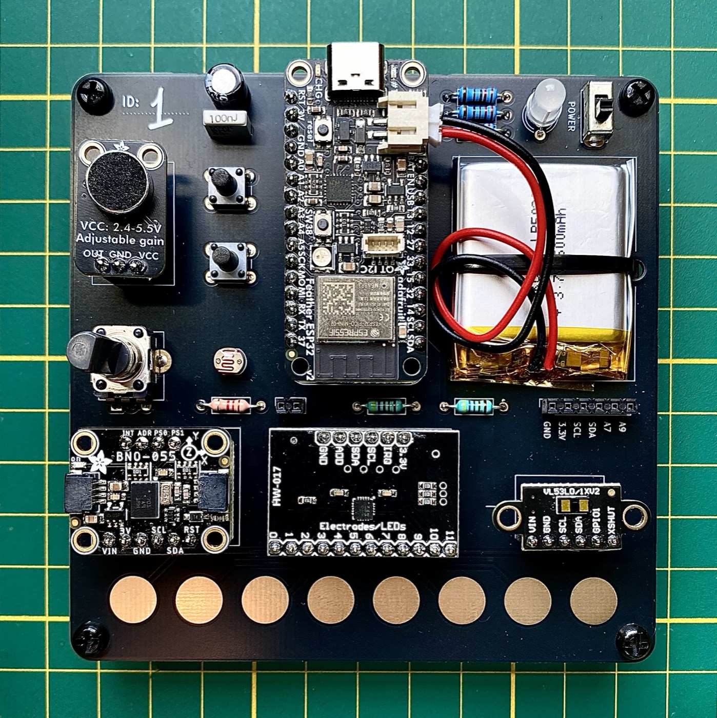 V2, board 1: Feather V2, sensors, battery, eight touch pads.